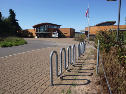Bike rack in the main parking lot - sidewalk made of concrete pavers - park headquarters - Wildlife Center